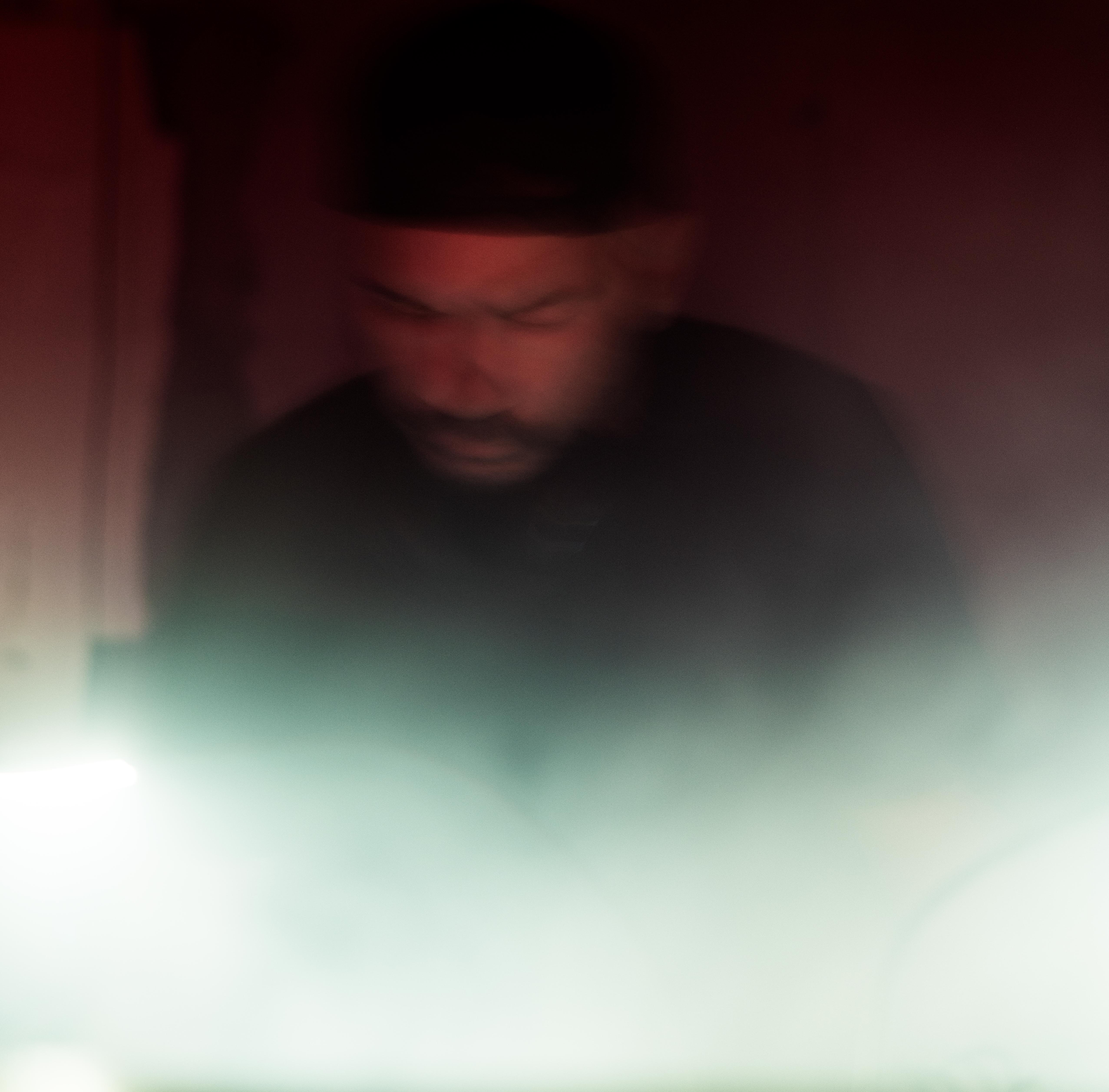 William White performing live — motion blur with red and green lighting