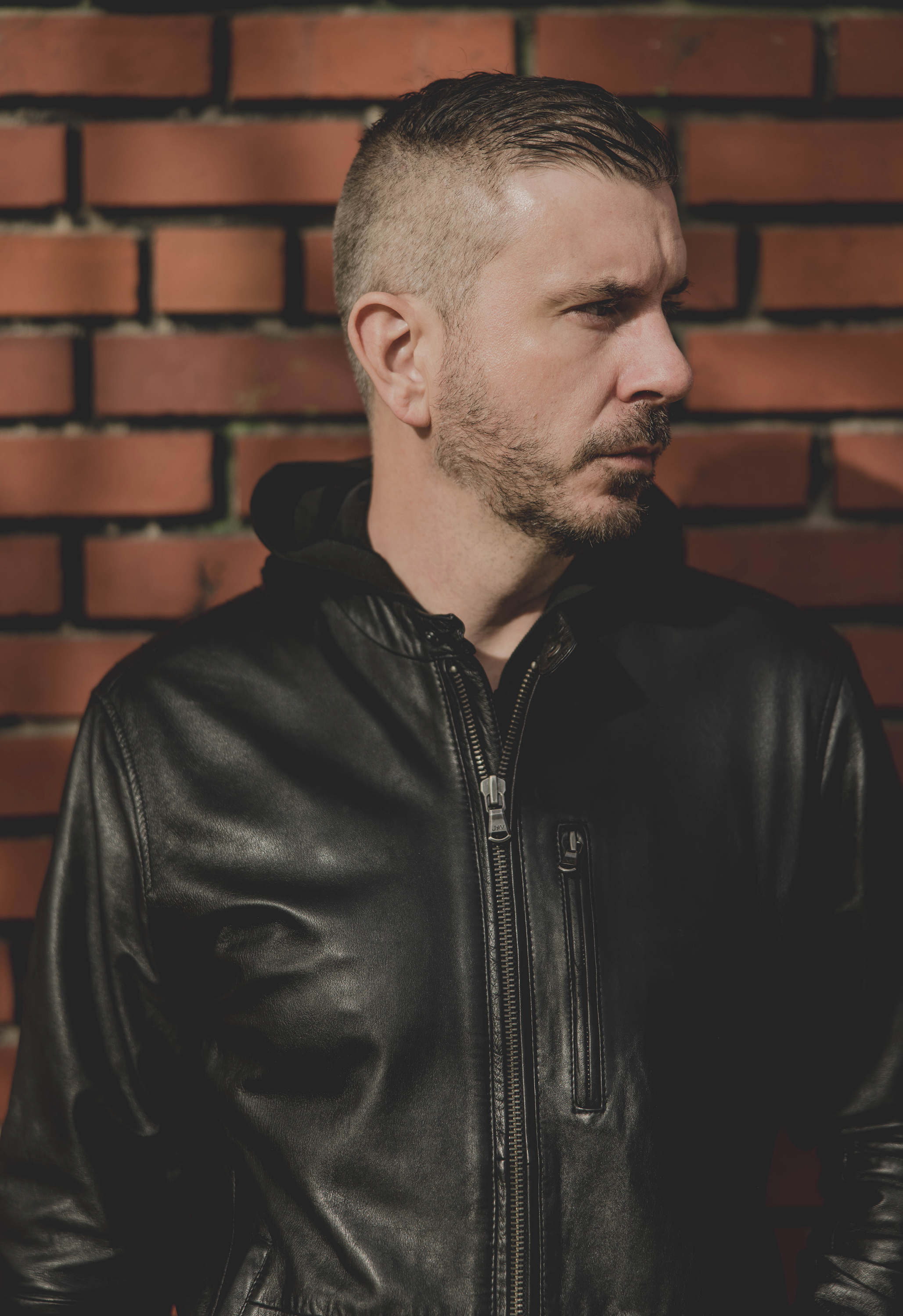 William White — side profile brick wall